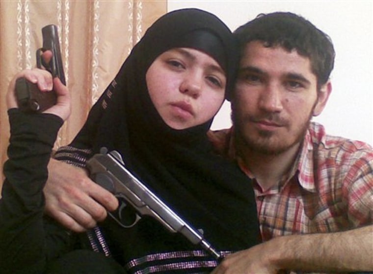 This undated picture provided by the Russian news agency NewsTeam, is claimed by the Russian Kommersant newspaper to show Dzhennet Abdurakhmanova, left, and her husband Islamist rebel Umalat Magomedov. 